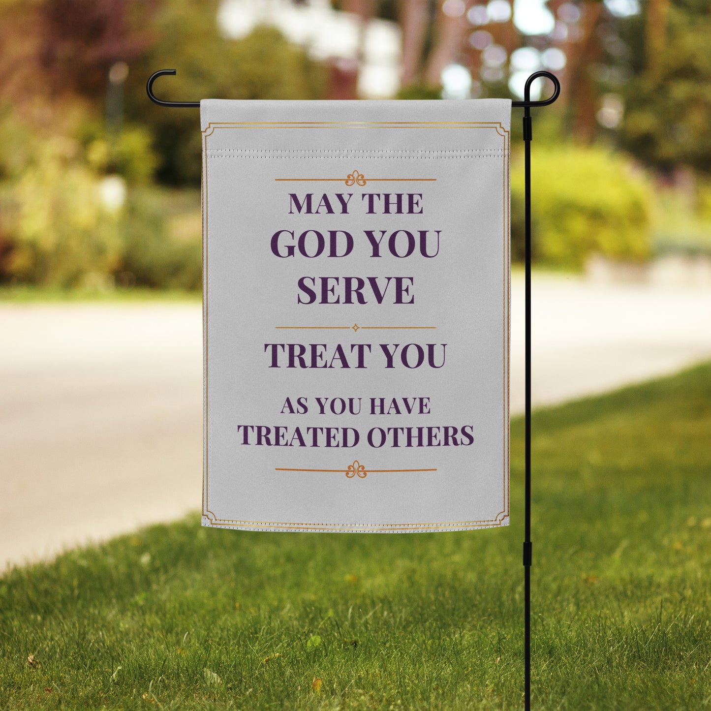 Close-up of May the God You Serve garden flag with inspirational quote